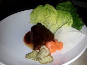 Pecan wood smoked brisket with lettuce, carrot, daikon and chili-hoison 
